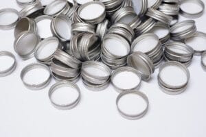 A pile of metal bottle caps