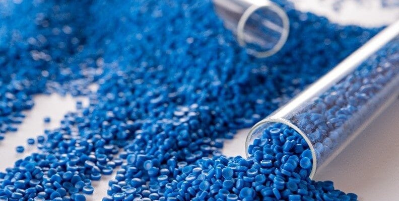 A stube of blue plastic granules