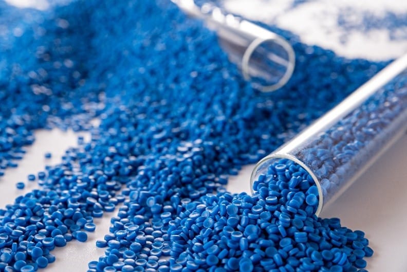 A stube of blue plastic granules