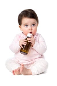 Origin Child Resistant Bottle Held By Infant Image