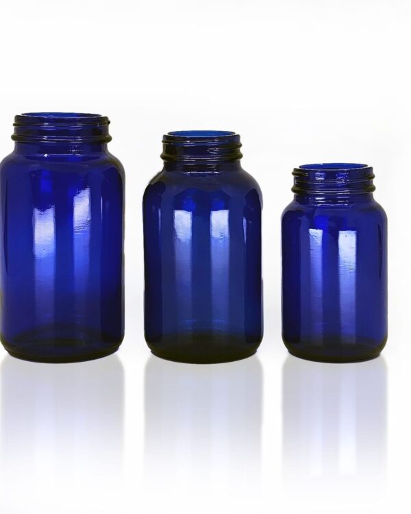 A photo of 3 blue pharma jars for packaging.